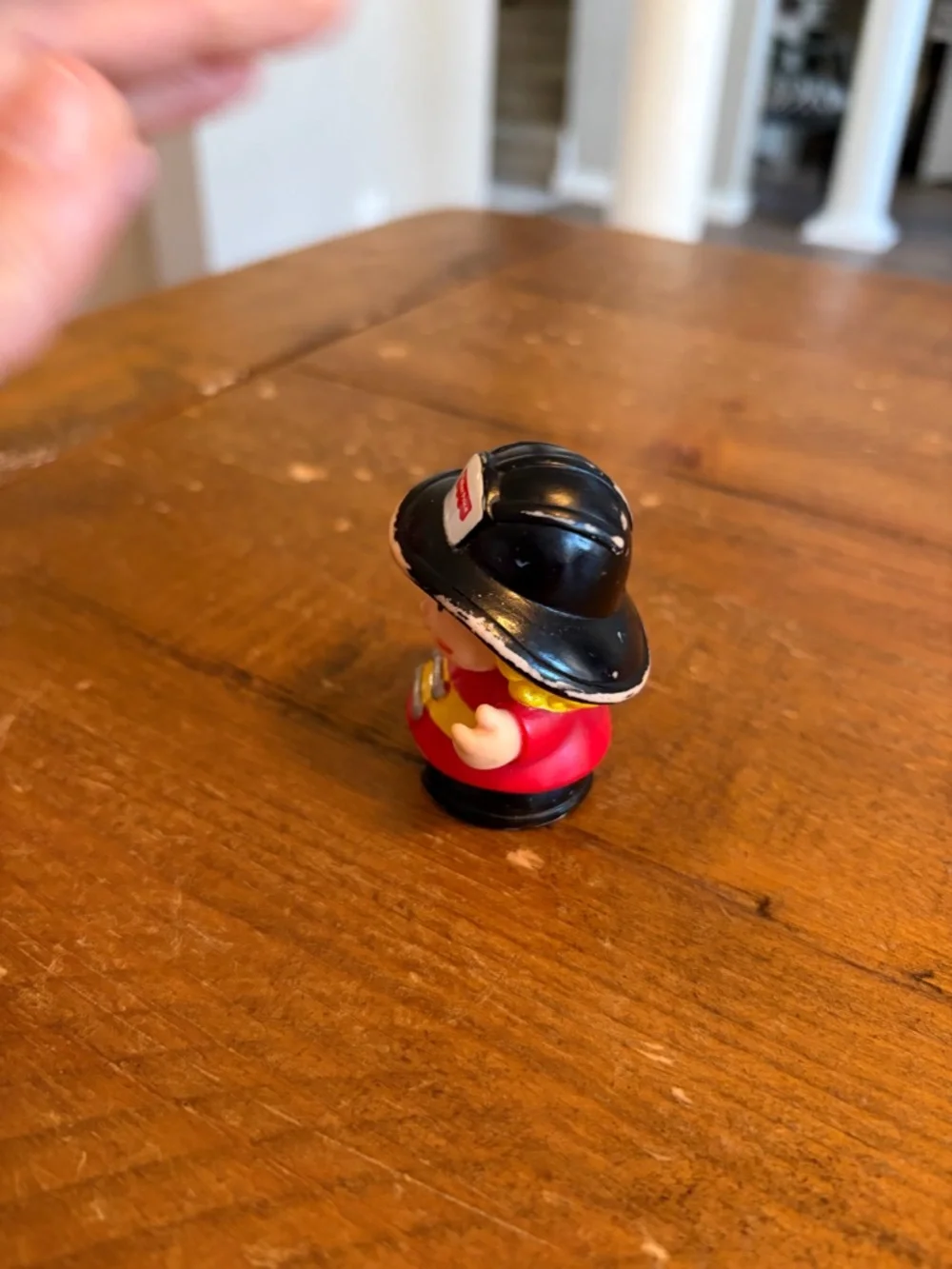 Fisher Price Little People firefighter as is. Has paint wear around hat